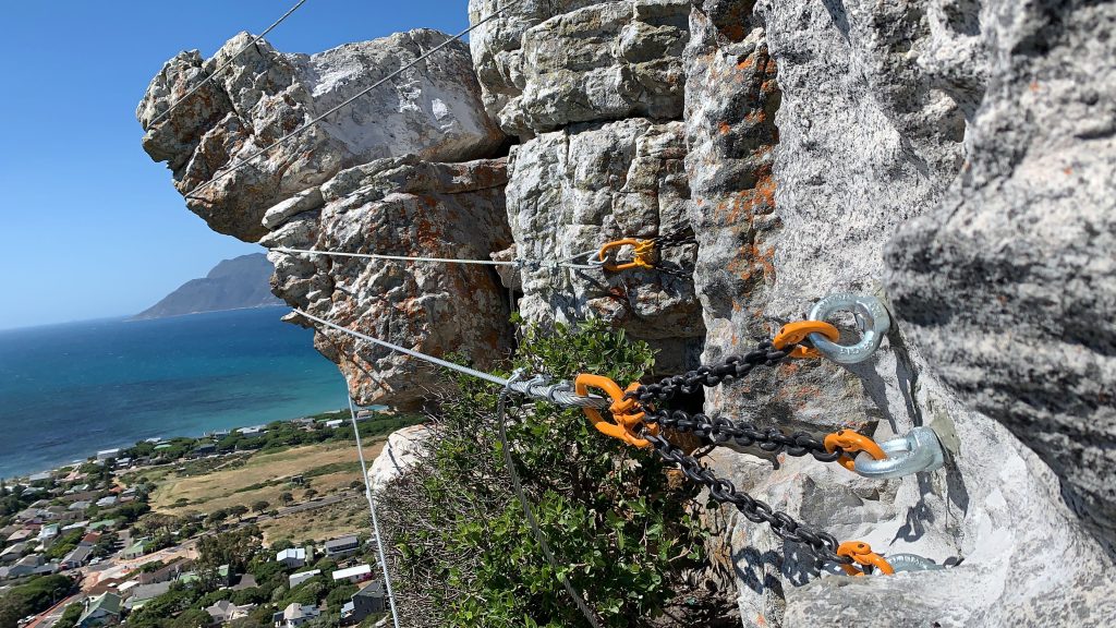 Toco Lifting steel wire rope slings and eye nuts with chain securing an unstable rock face, Cape Town Metro